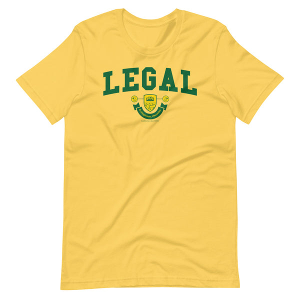 A yellow t-shirt with the Legal Crest on it in green with yellow accents. 
